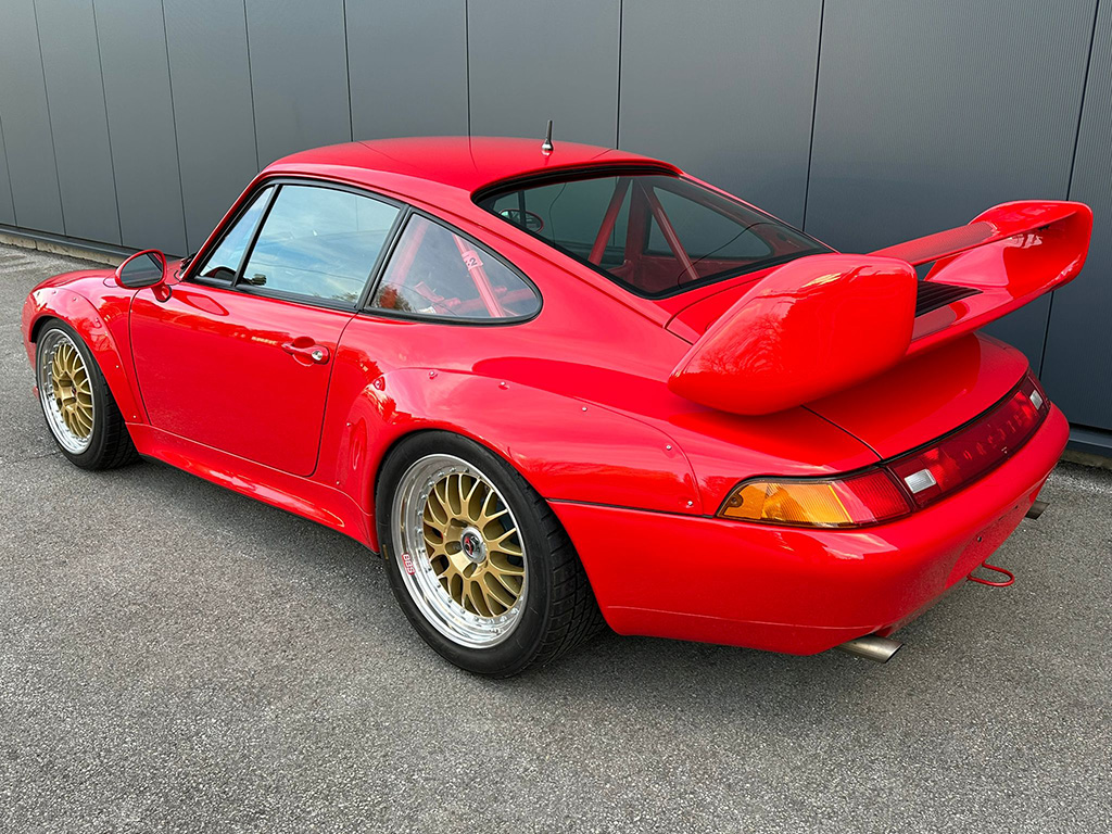 1997 Porsche 911 Cup 3.8 RSR in Guards Red, rear three-quarter view