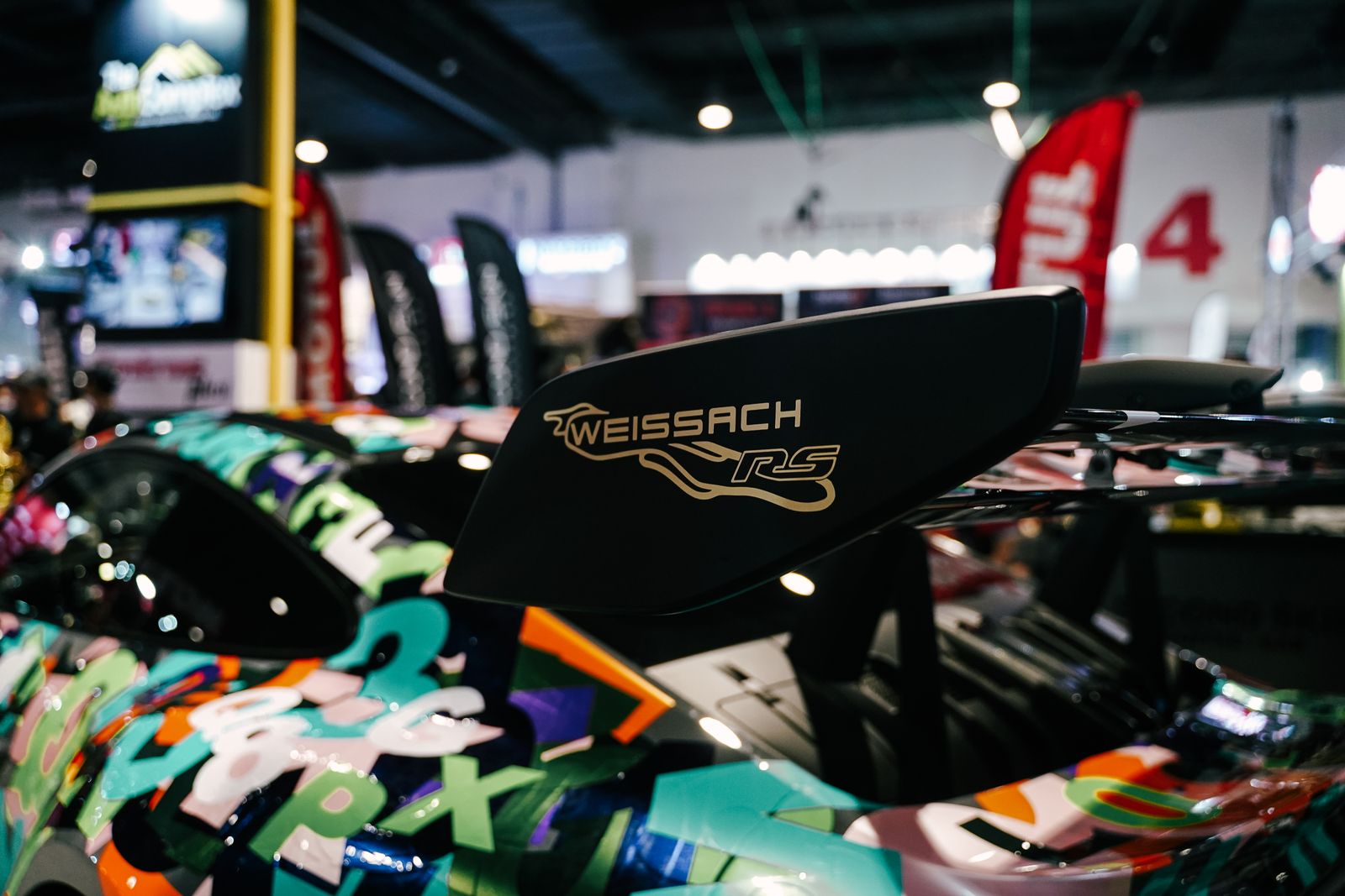 Weissach RSR rear wing detail in a race paddock.