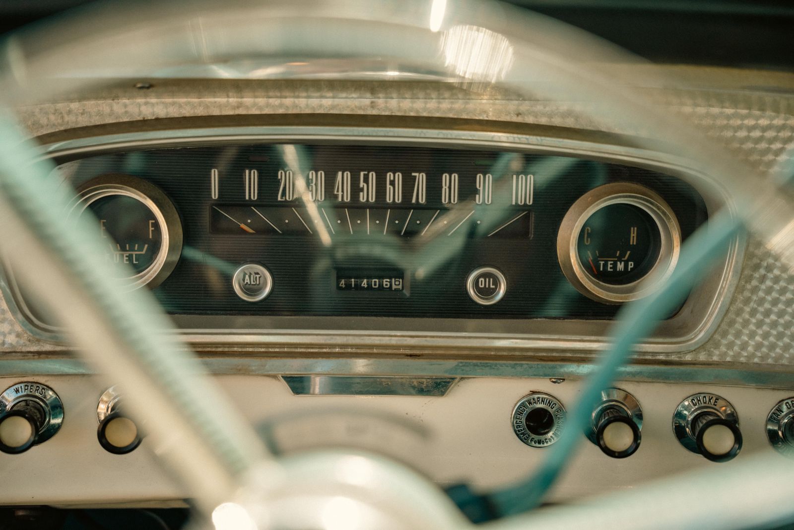 Vintage speedometer strip on a classic dashboard.